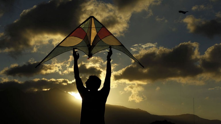 A man flies a kite at the Peace Park in San Jose, January 10, 2013.